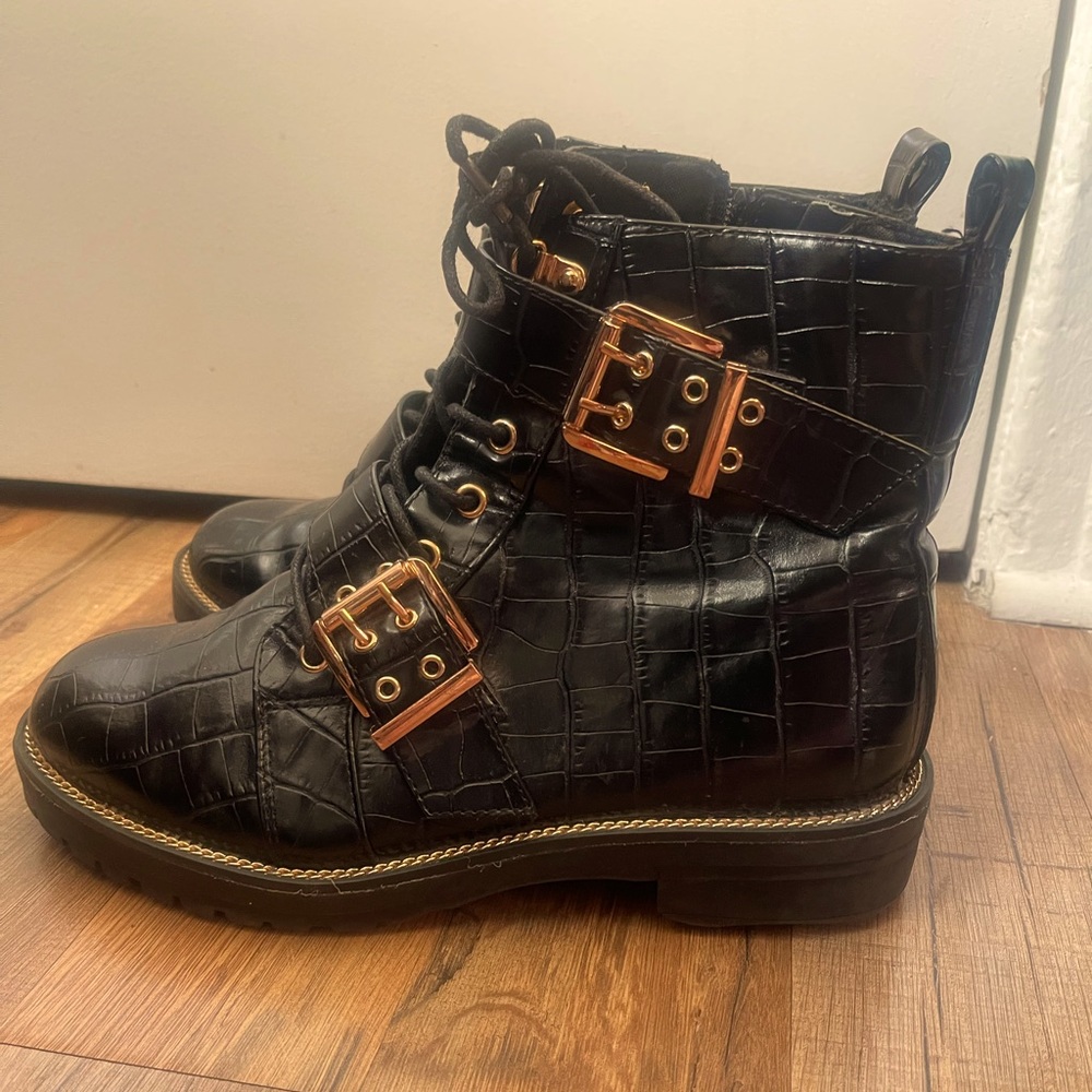 Textured Leather Boots with Two Golden Buckles with a side zipper.